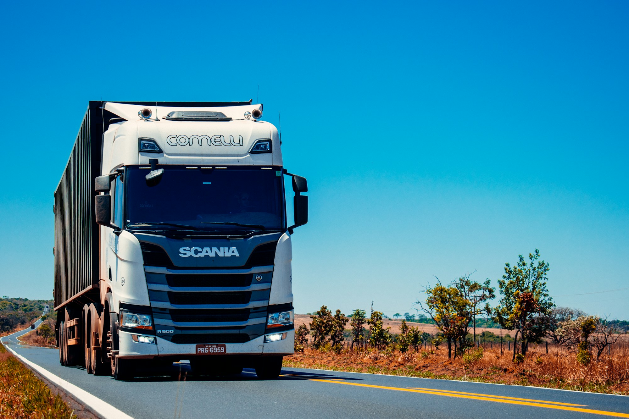 Commercial truck on a motorway at dusk