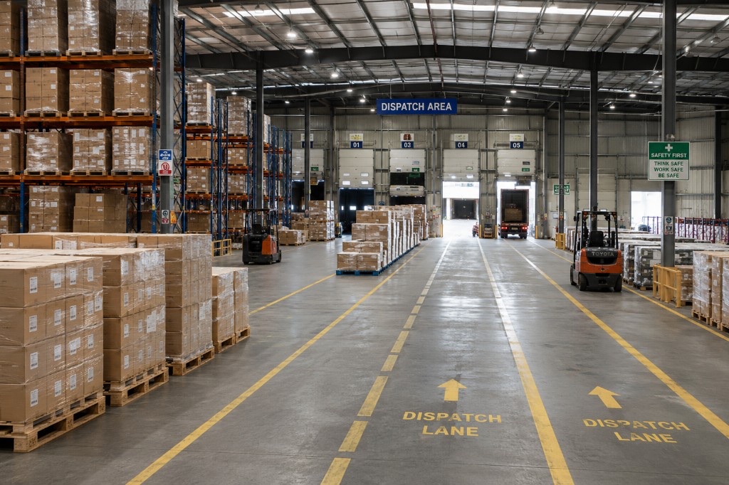 Warehouse interior with pallets and dispatch lanes